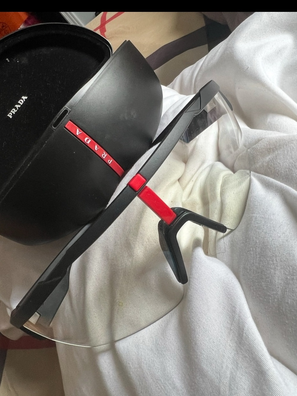 Prada Black and Red Frameless Shield Sunglasses